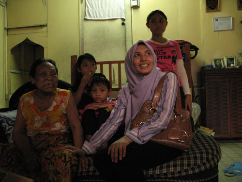Meeting a family at the long house kampung in Pantai Dalam.